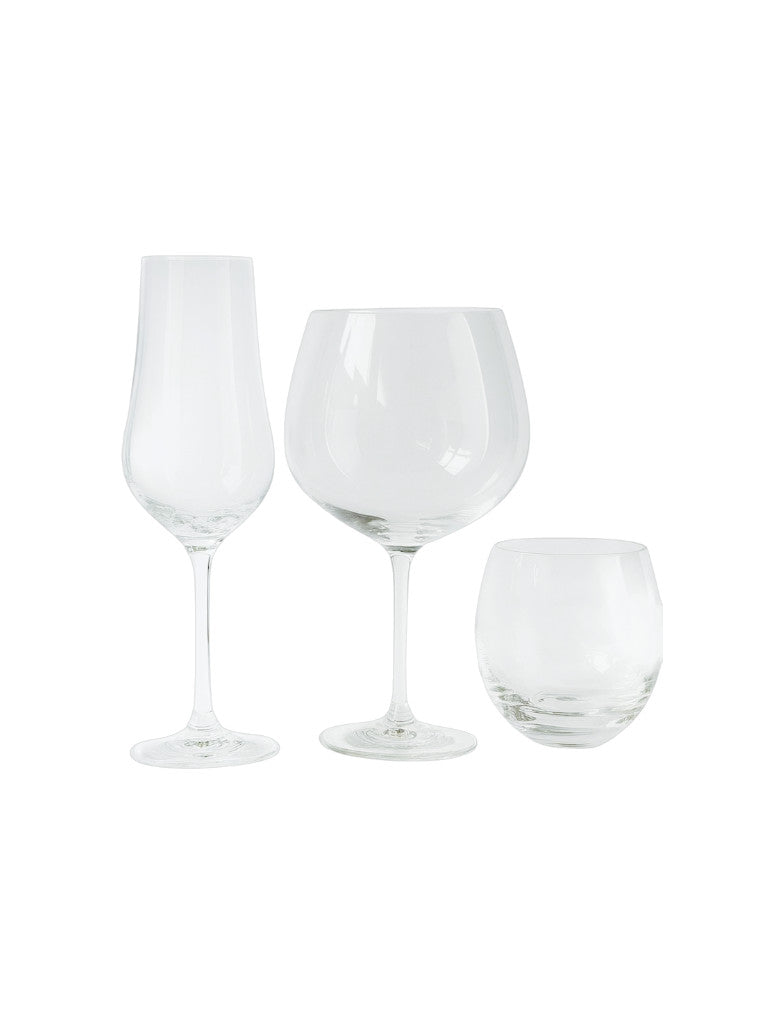 Set di calici e bicchieri in vetro trasparente per vino, champagne e acqua, con linee pulite ed essenziali, a noleggio