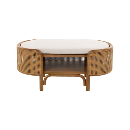 Tavolino ovale basso in legno naturale e rattan intrecciato con piano superiore imbottito color crema, a noleggio a Roma